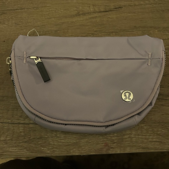lululemon athletica Handbags - lululemon athletica everywhere Belt Bag with long strap in Lavender